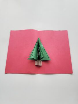 Pop-up Christmas tree card with folded cardboard tree trunk