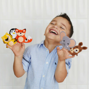 Boy playing with Early Explorers finger puppets.